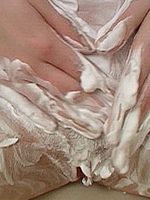 Busty teen foaming and toying her shaved pussy with dildo