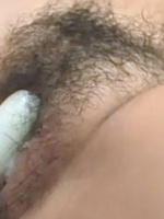 Japanese teen undresses to receive dildo in tight hairy muff