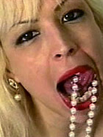 Seventies lady giving a sexy show with her pearl necklace