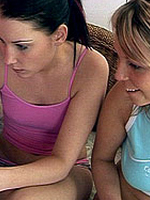 Two naughty teen girlies having fun with their orange friend