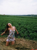 Teenage girlie pulling up her thong in her slit