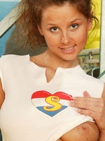 Brunette teenager showing her sexy round and big boobies